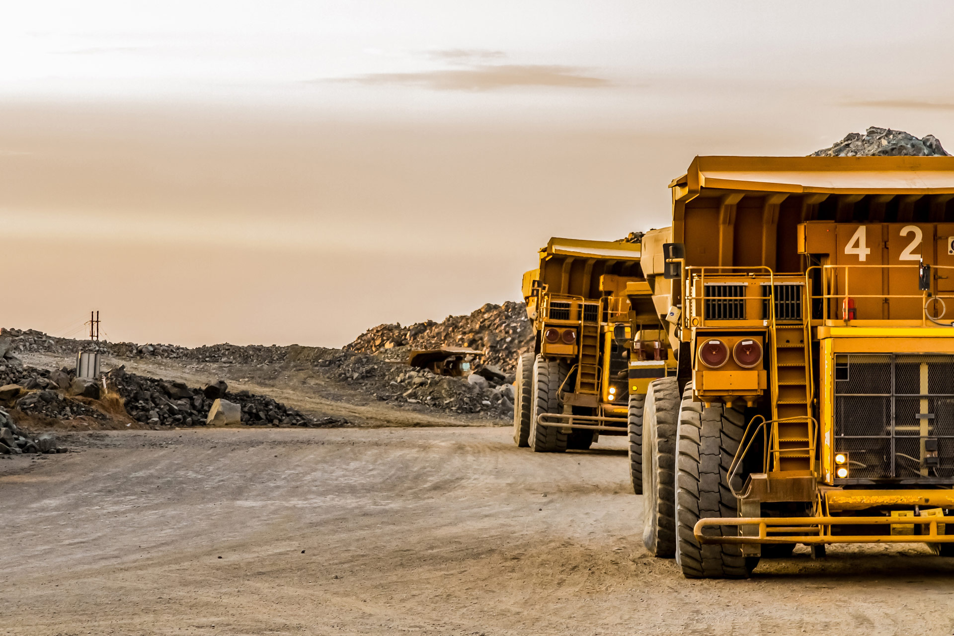 Mining Dump Trucks Transporting Ore